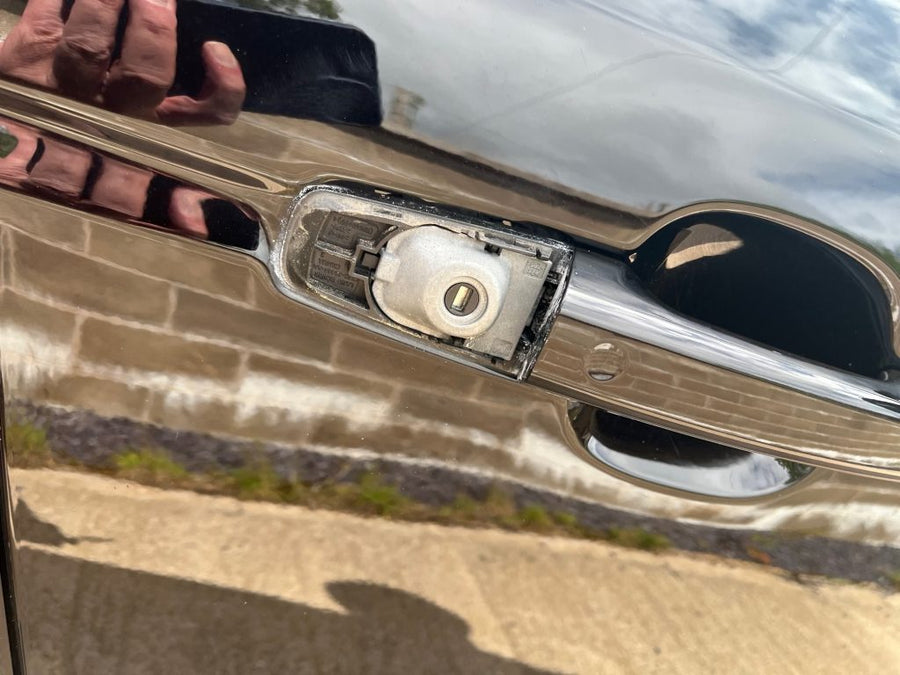 Vehicle door lock cap removed